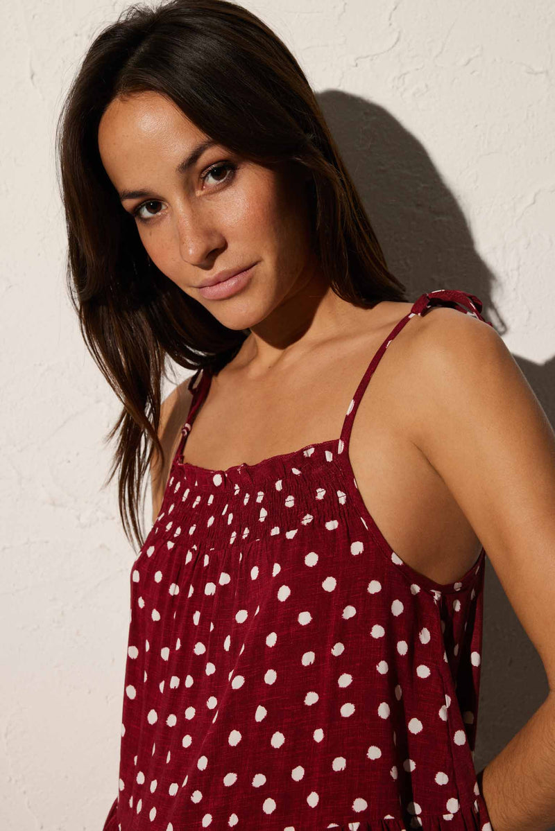 Short beach dress with knotted straps in maroon plumeti print