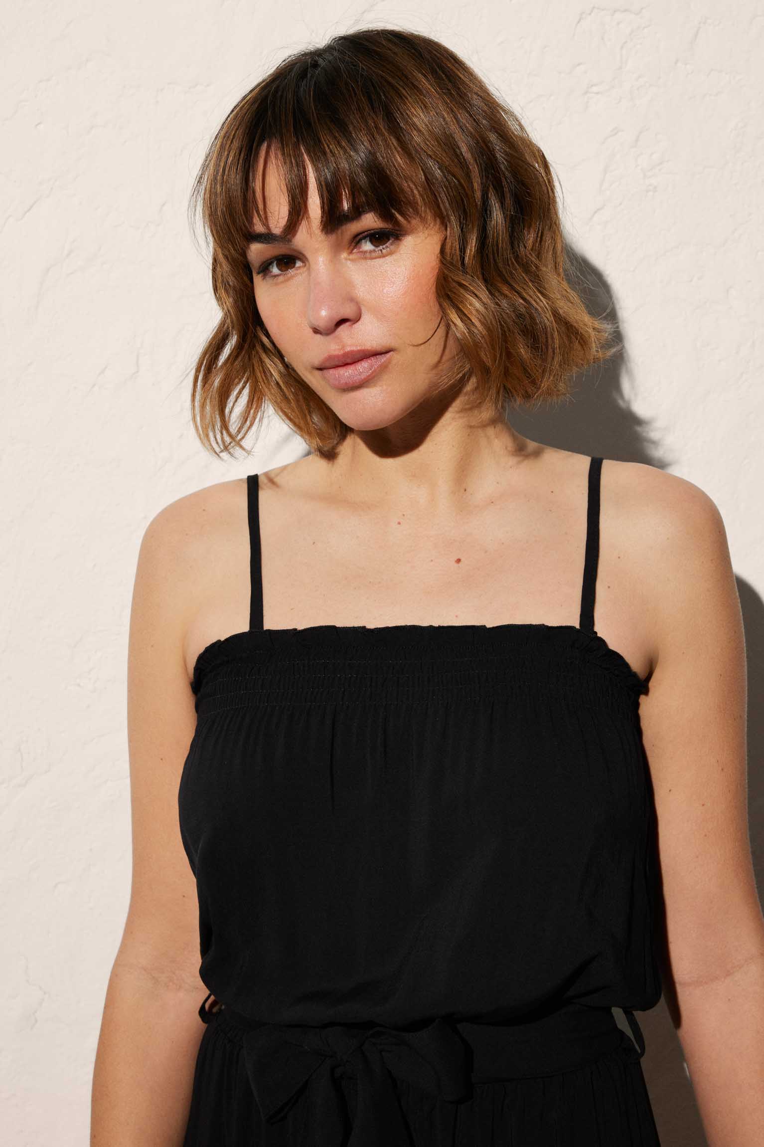 Short plain black beach jumpsuit with removable straps