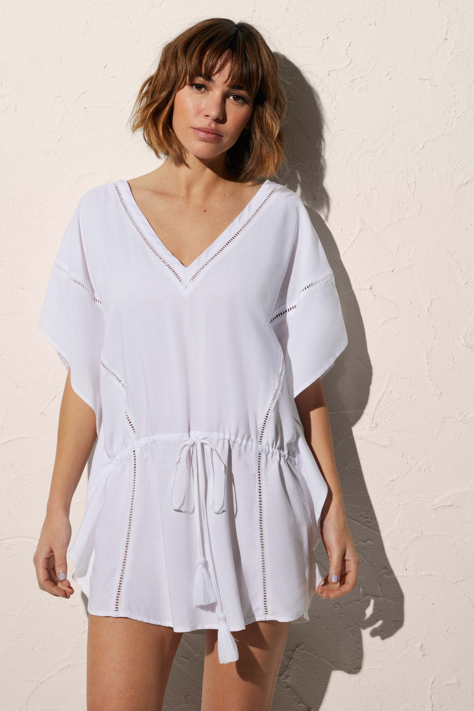 Short plain white kaftan with bow and pompom detail