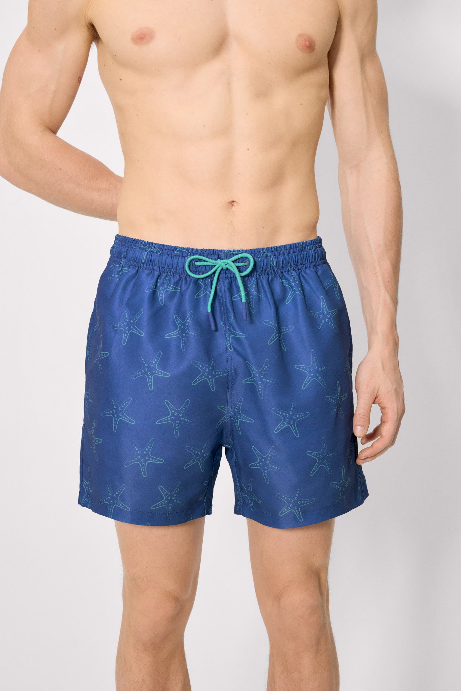 Mid-length swimsuit with starfish print in blue