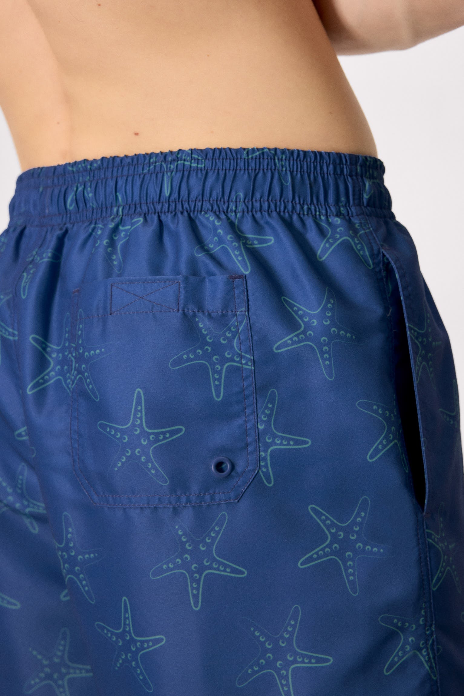 Mid-length swimsuit with starfish print in blue