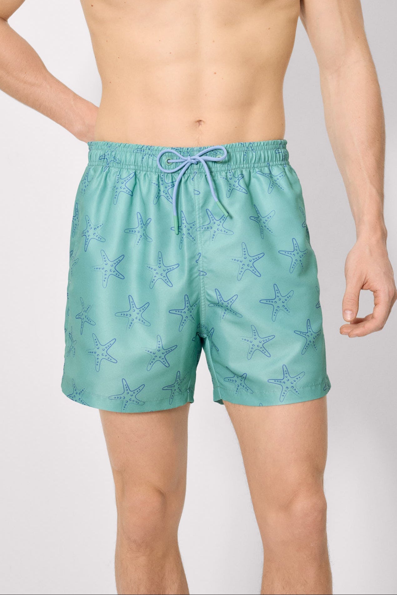 Half swimsuit with green starfish print
