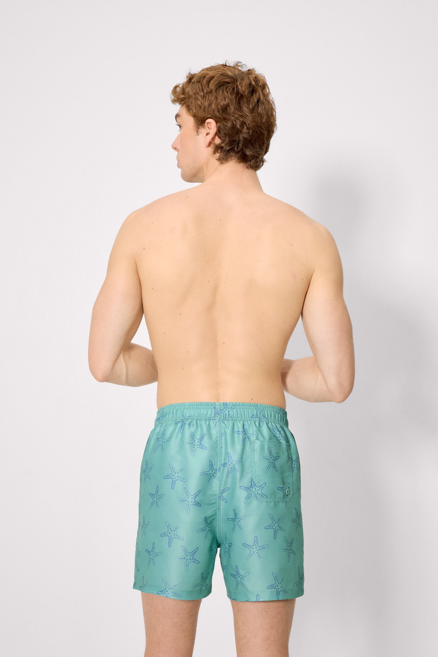 Half swimsuit with green starfish print