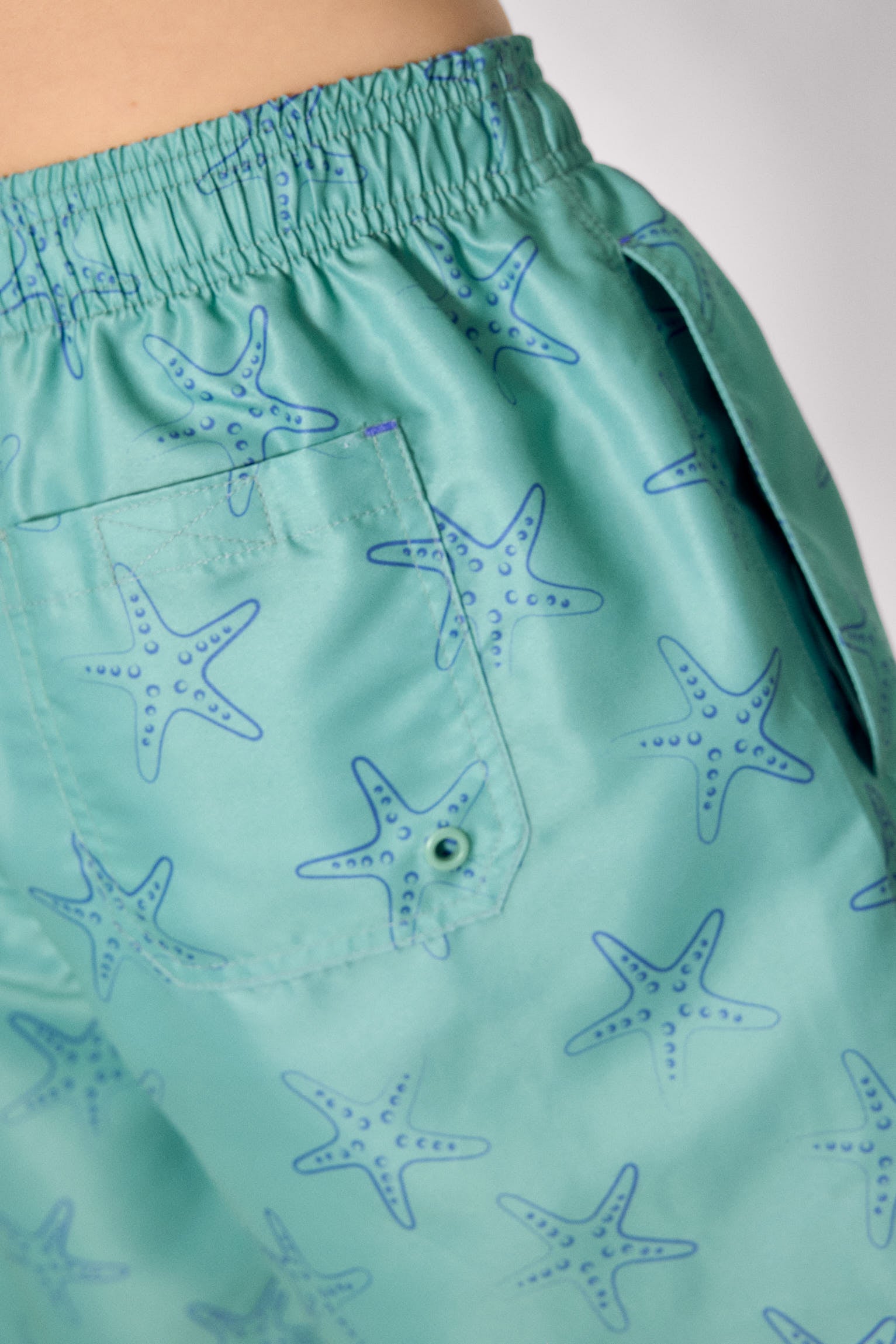 Half swimsuit with green starfish print