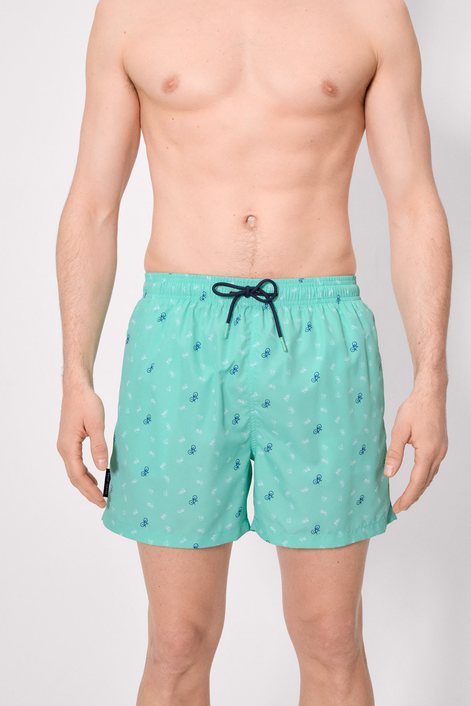 Half swimsuit with green bicycle print