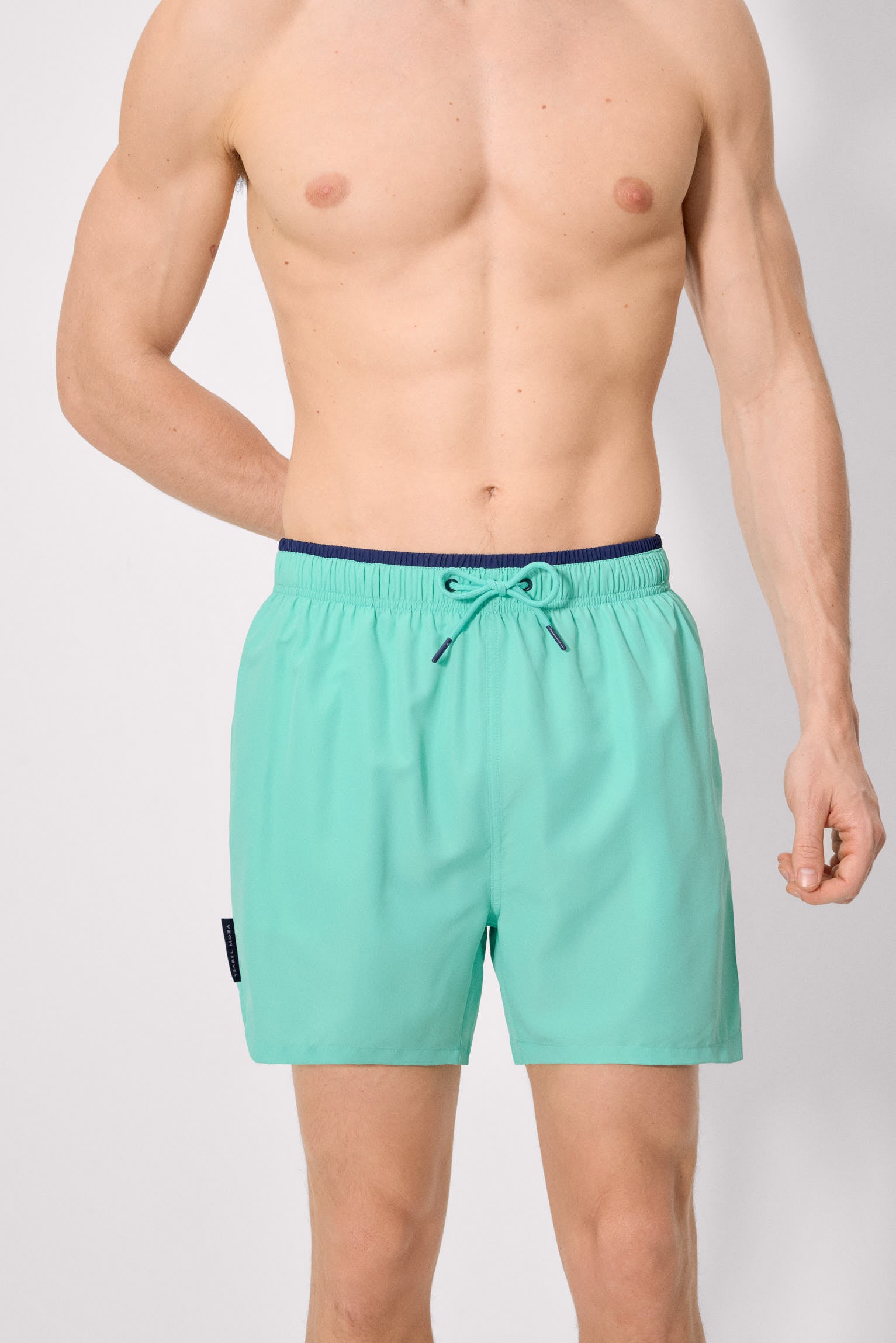 Basic mid-length swimsuit with green waist detail