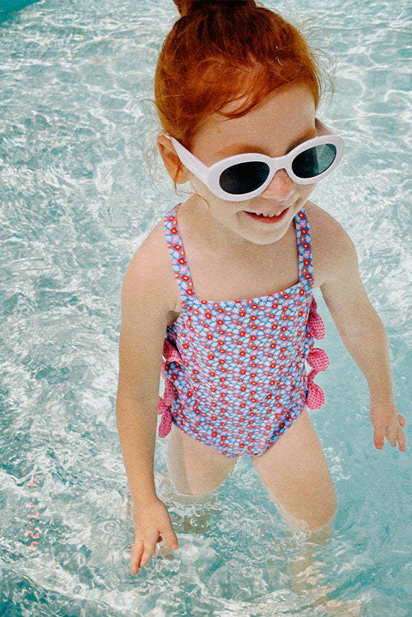 Girl's swimsuit with small flower bows detail