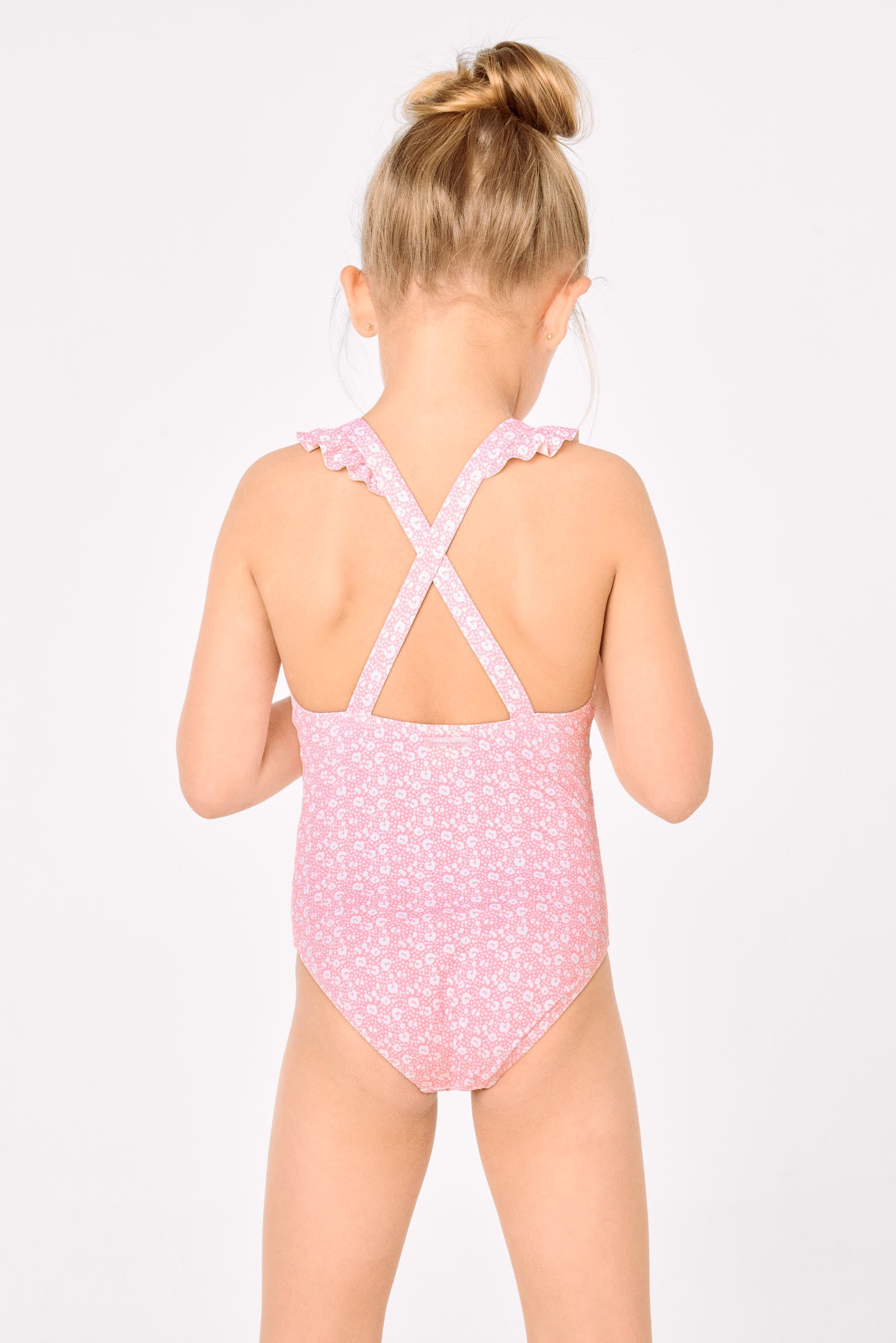 Girls' swimsuit with ruffle details and crossed straps, pink leopard print