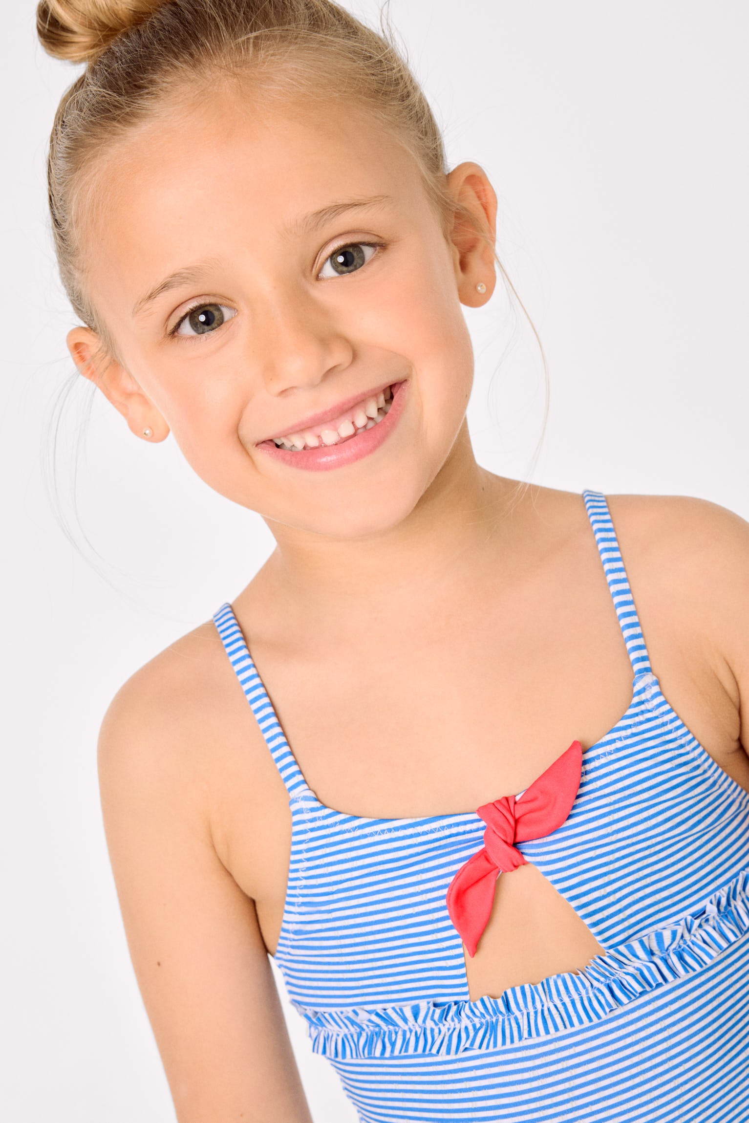 Girls' swimsuit with bow and ruffle detail, striped print