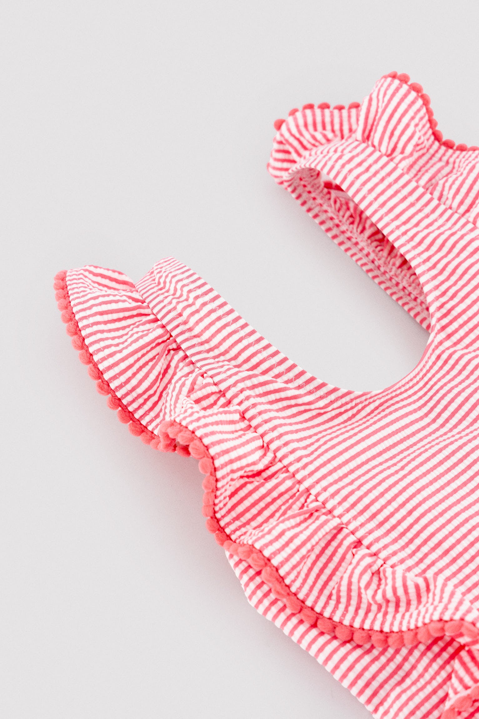 Girls' swimsuit with ruffled striped print
