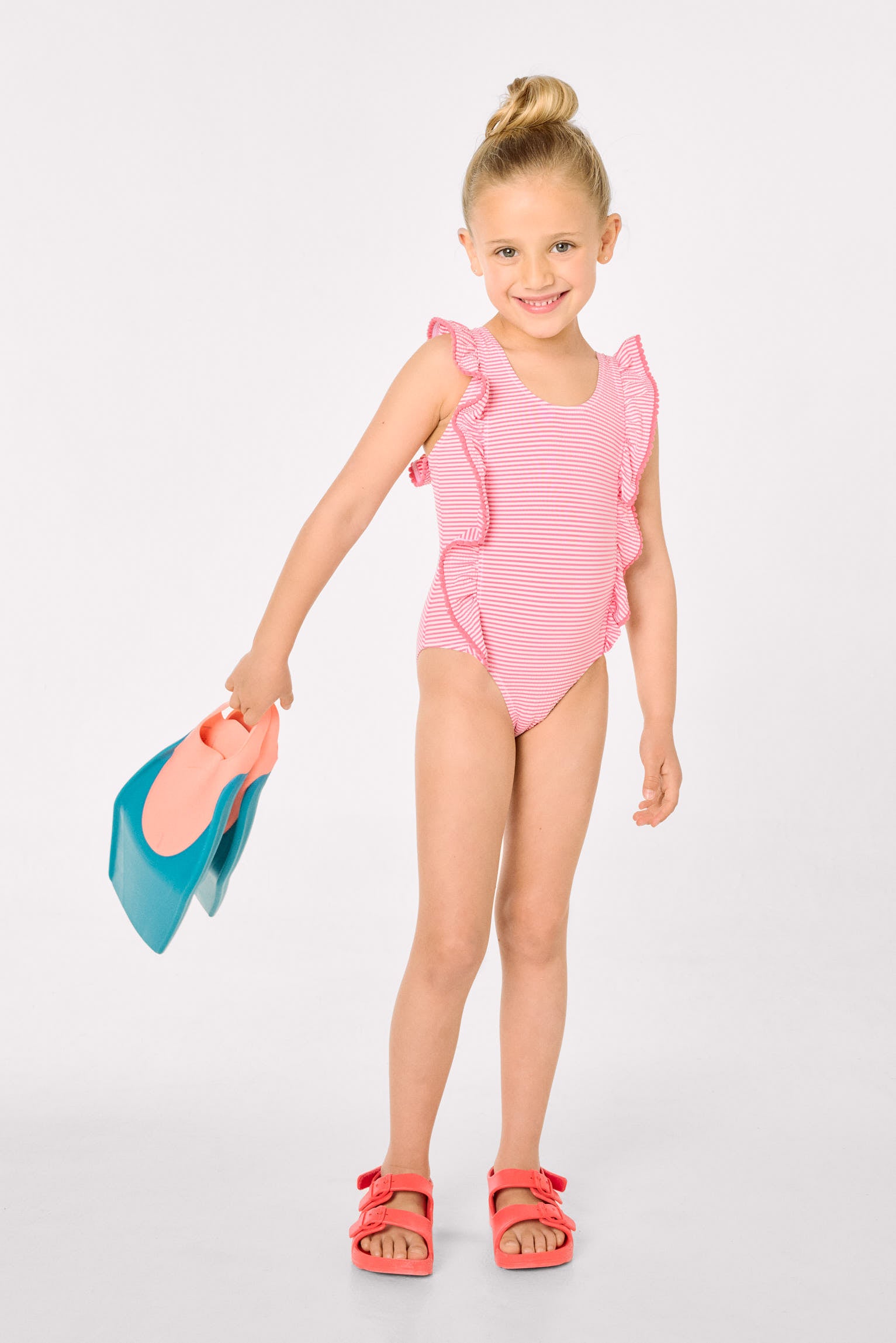 Girls' swimsuit with ruffled striped print
