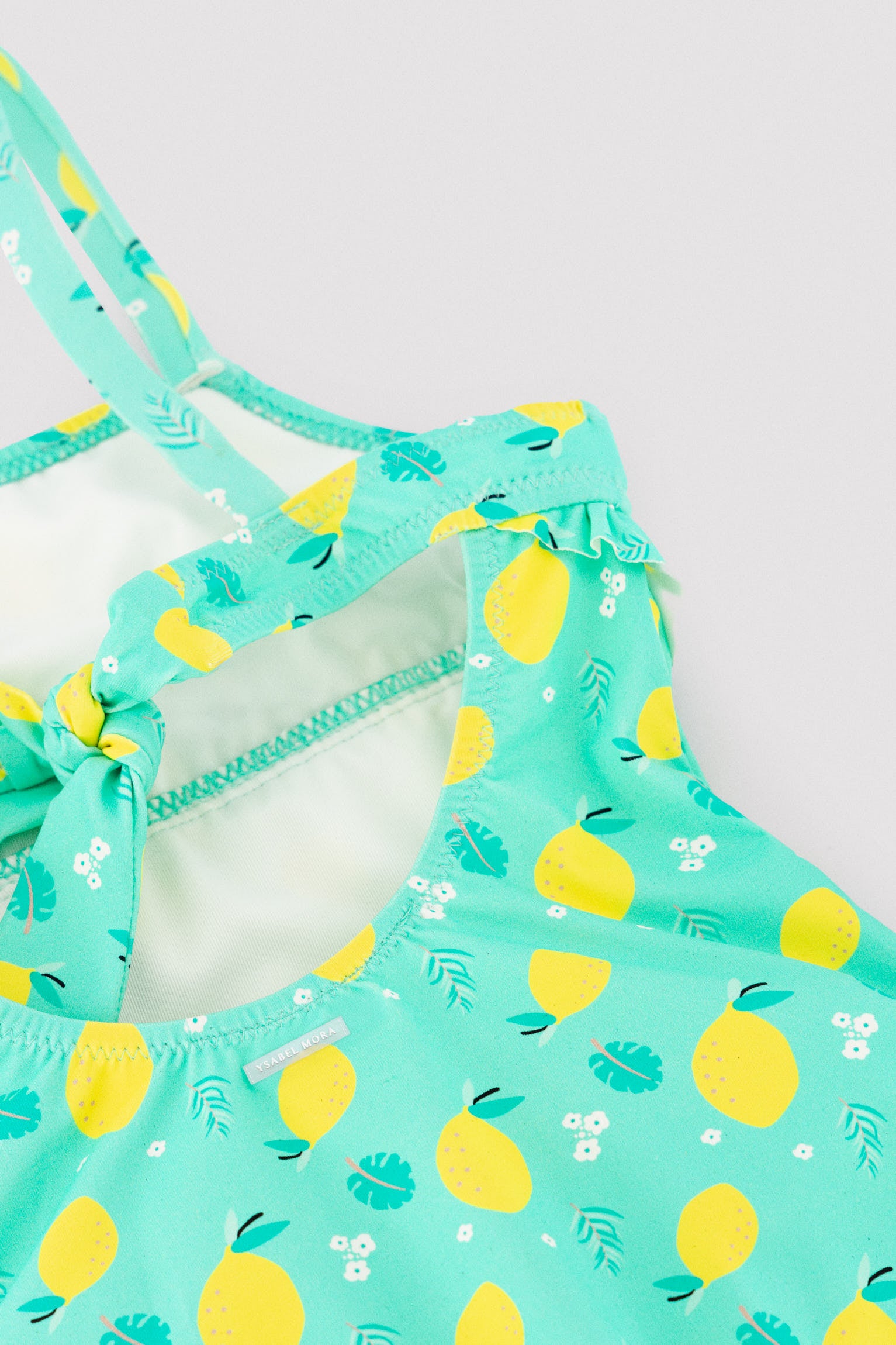Girl's swimsuit with lemon print ruffle detail