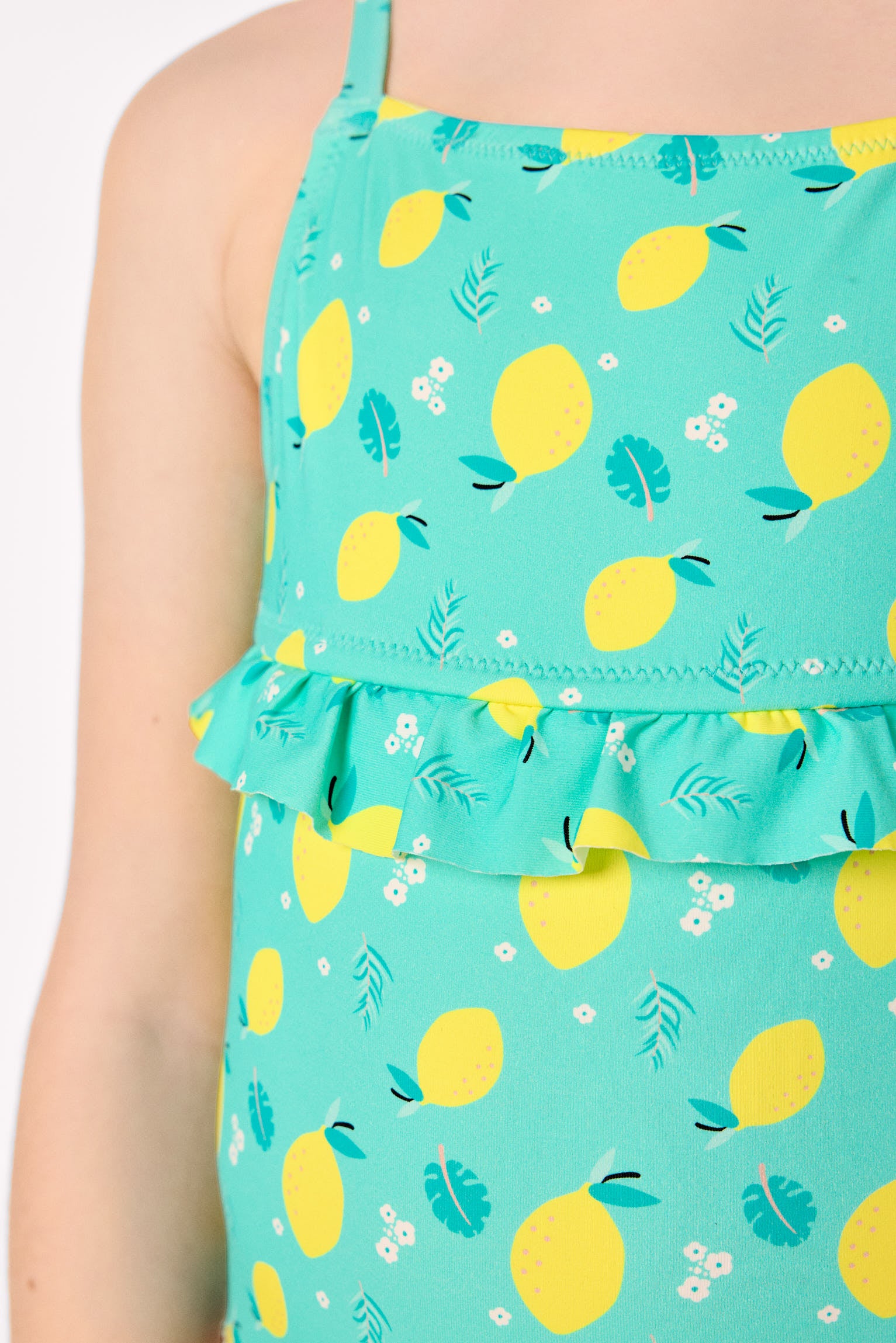 Girl's swimsuit with lemon print ruffle detail