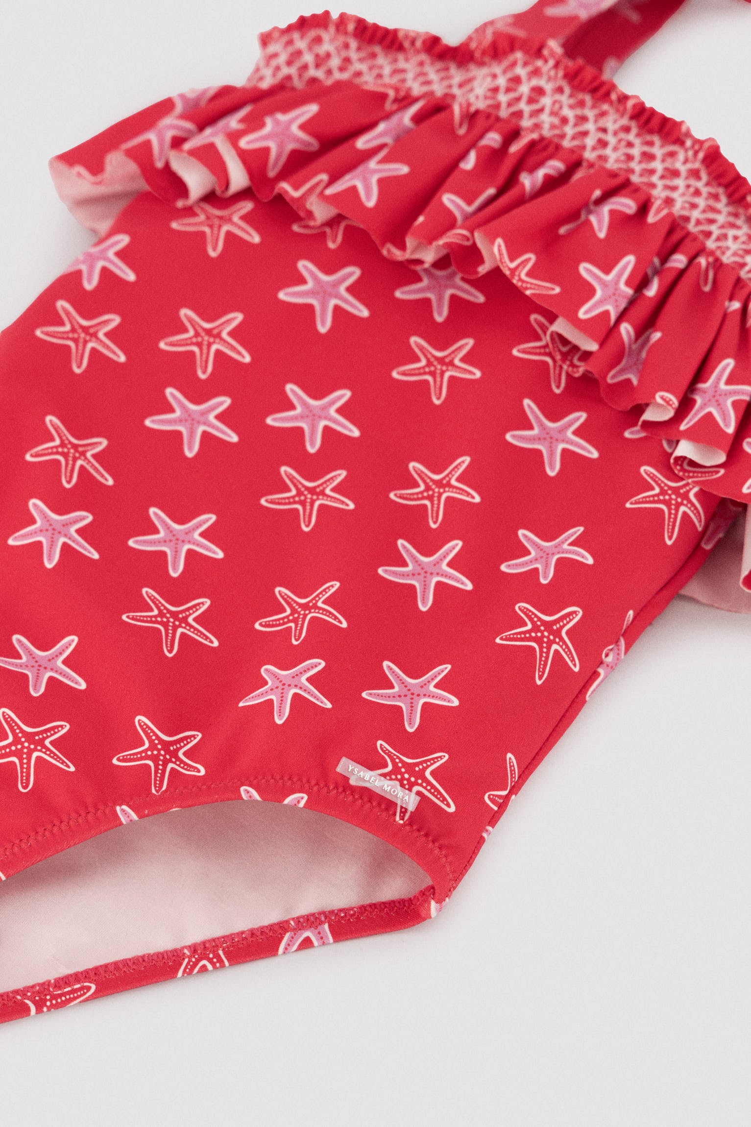 Girls' swimsuit with starfish print ruffle detail