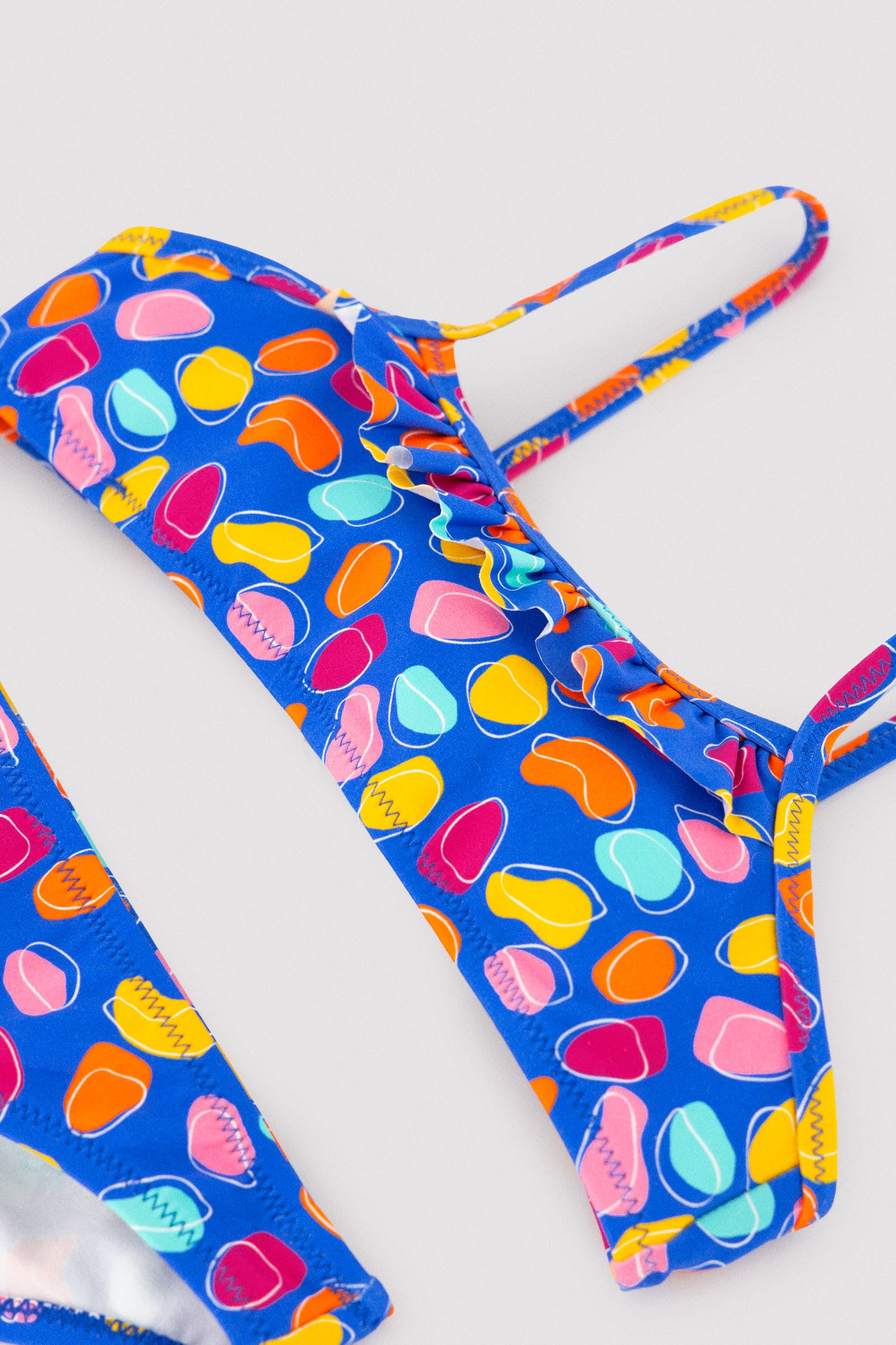Girls' bikini with ruffle detail, multicolored organic shapes print