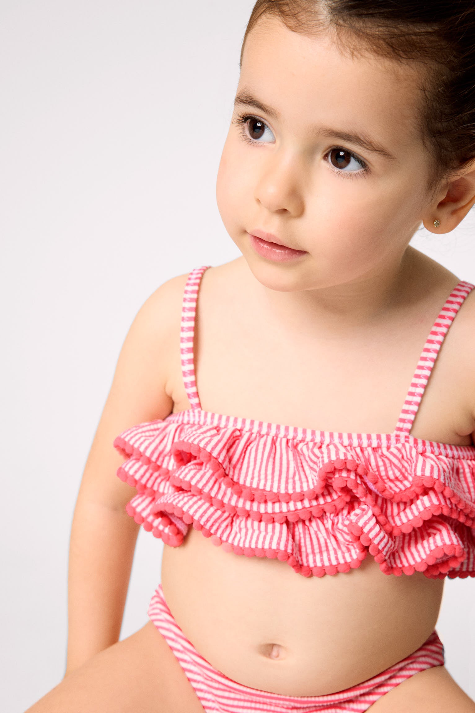 Girls' bikini with triple ruffle detail and striped print