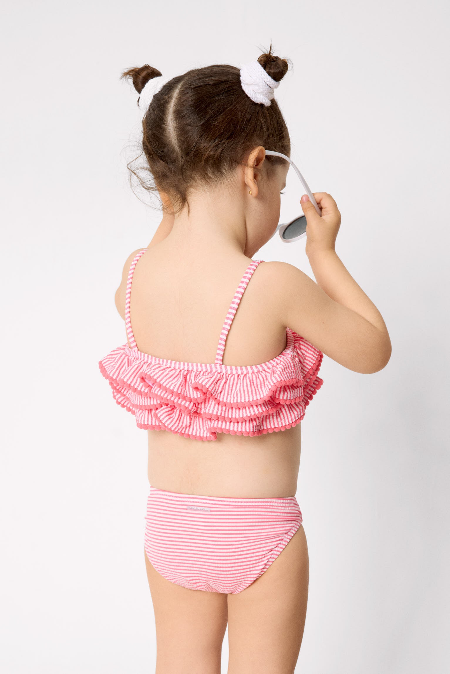 Girls' bikini with triple ruffle detail and striped print