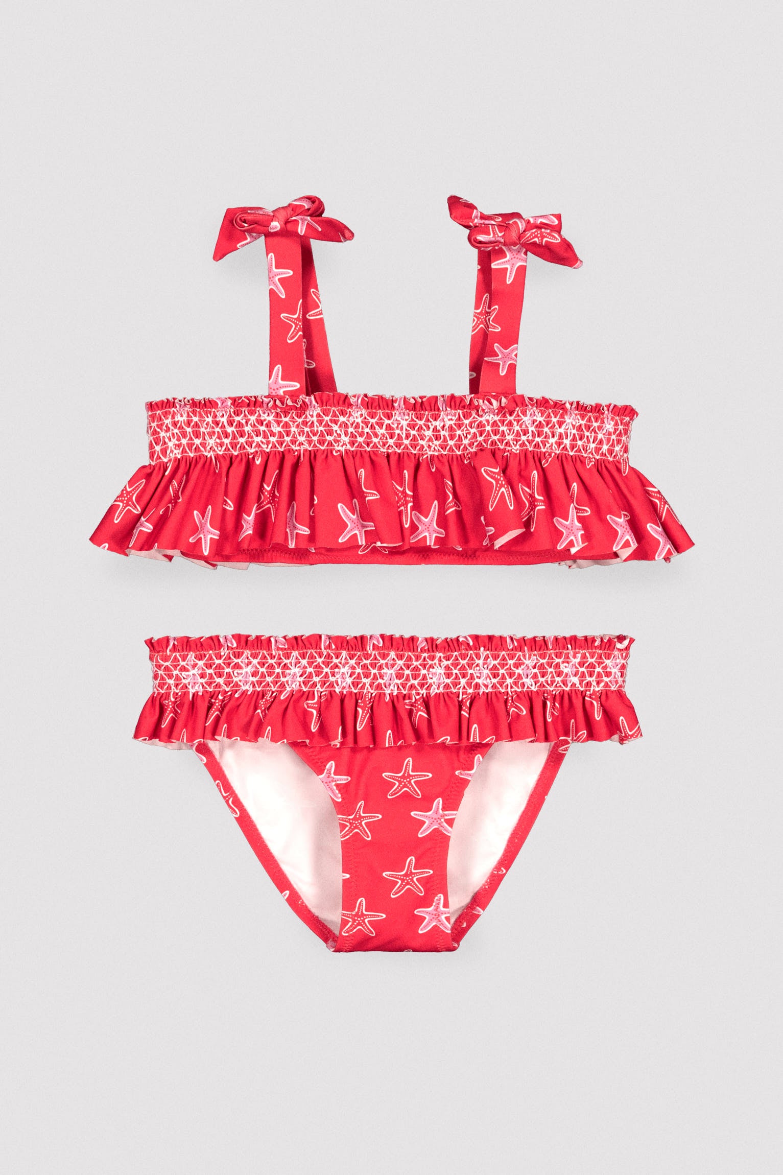 Girls' bikini with ruffle details and honeycomb pattern with starfish
