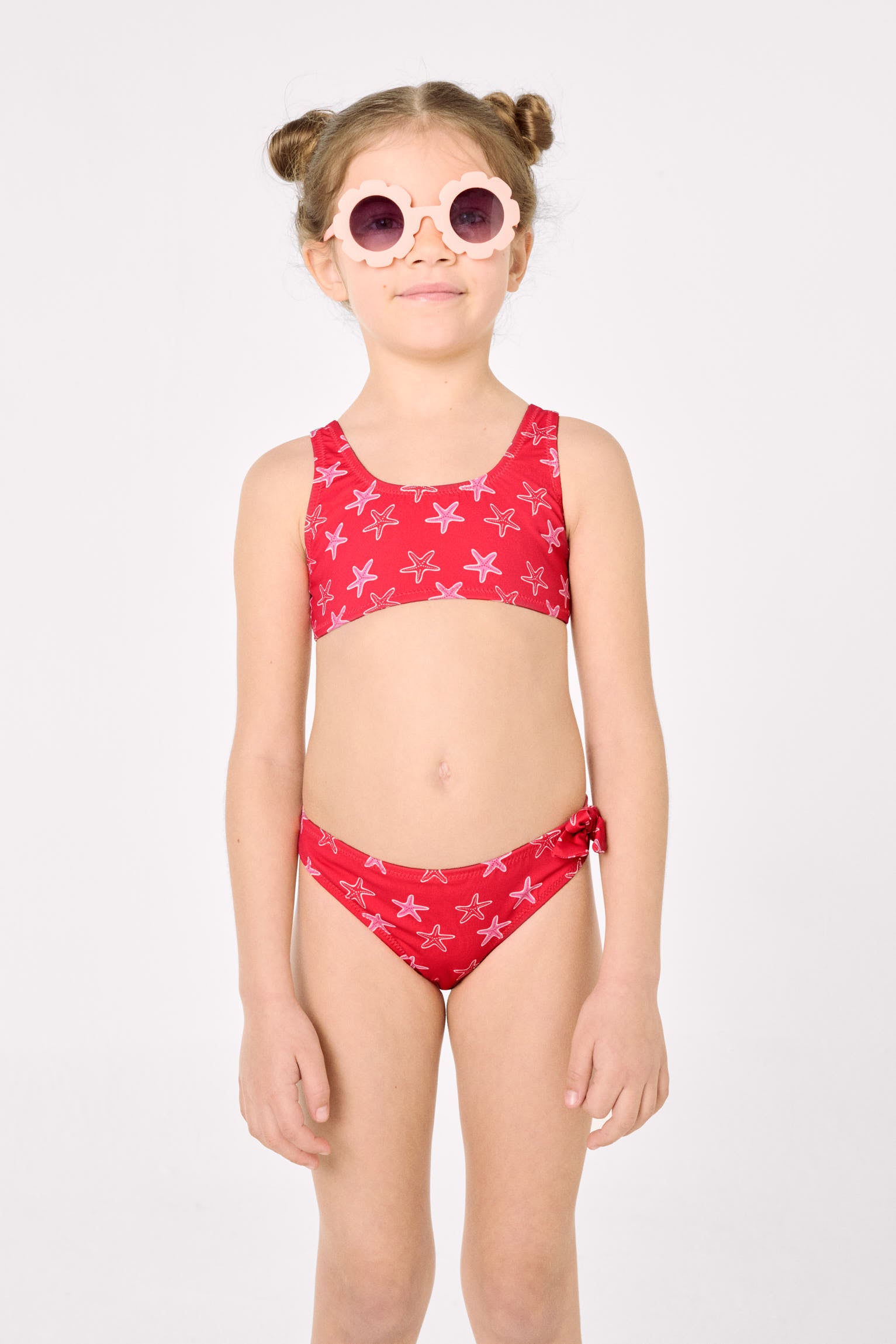 Girls' bikini with ruffle details and bows, starfish print