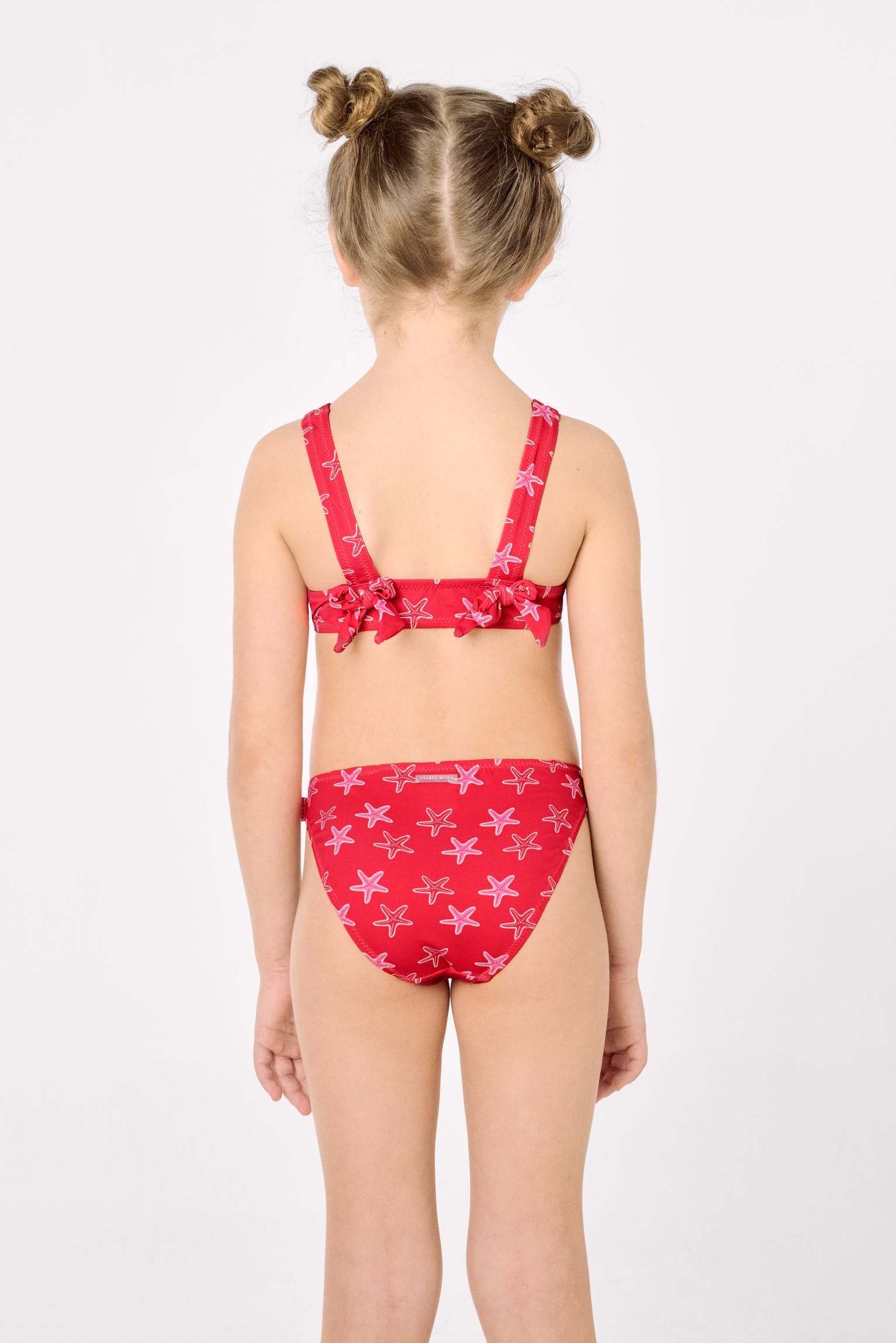 Girls' bikini with ruffle details and bows, starfish print