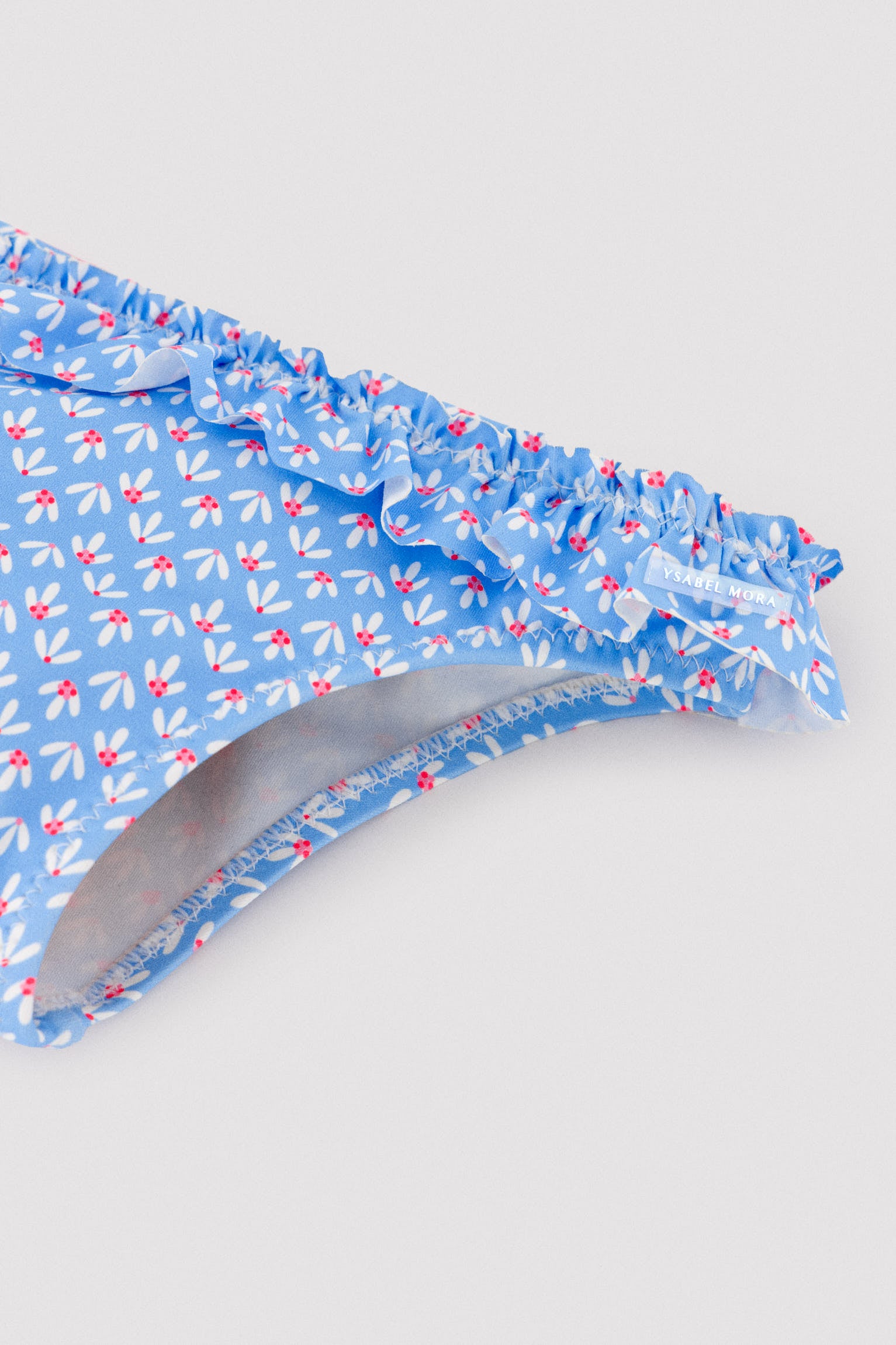 Baby bloomers with ruffle details and bows, floral print