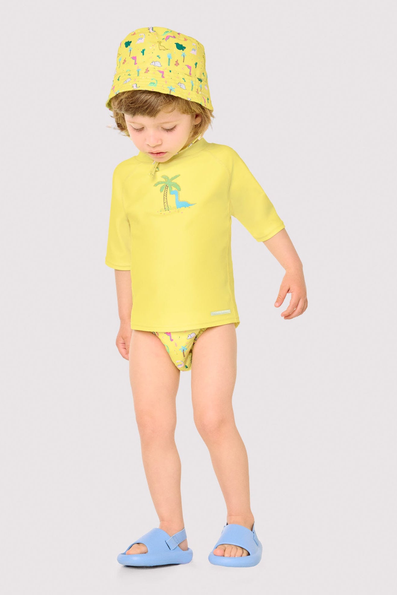 Baby swim shirt with dinosaur and palm tree print