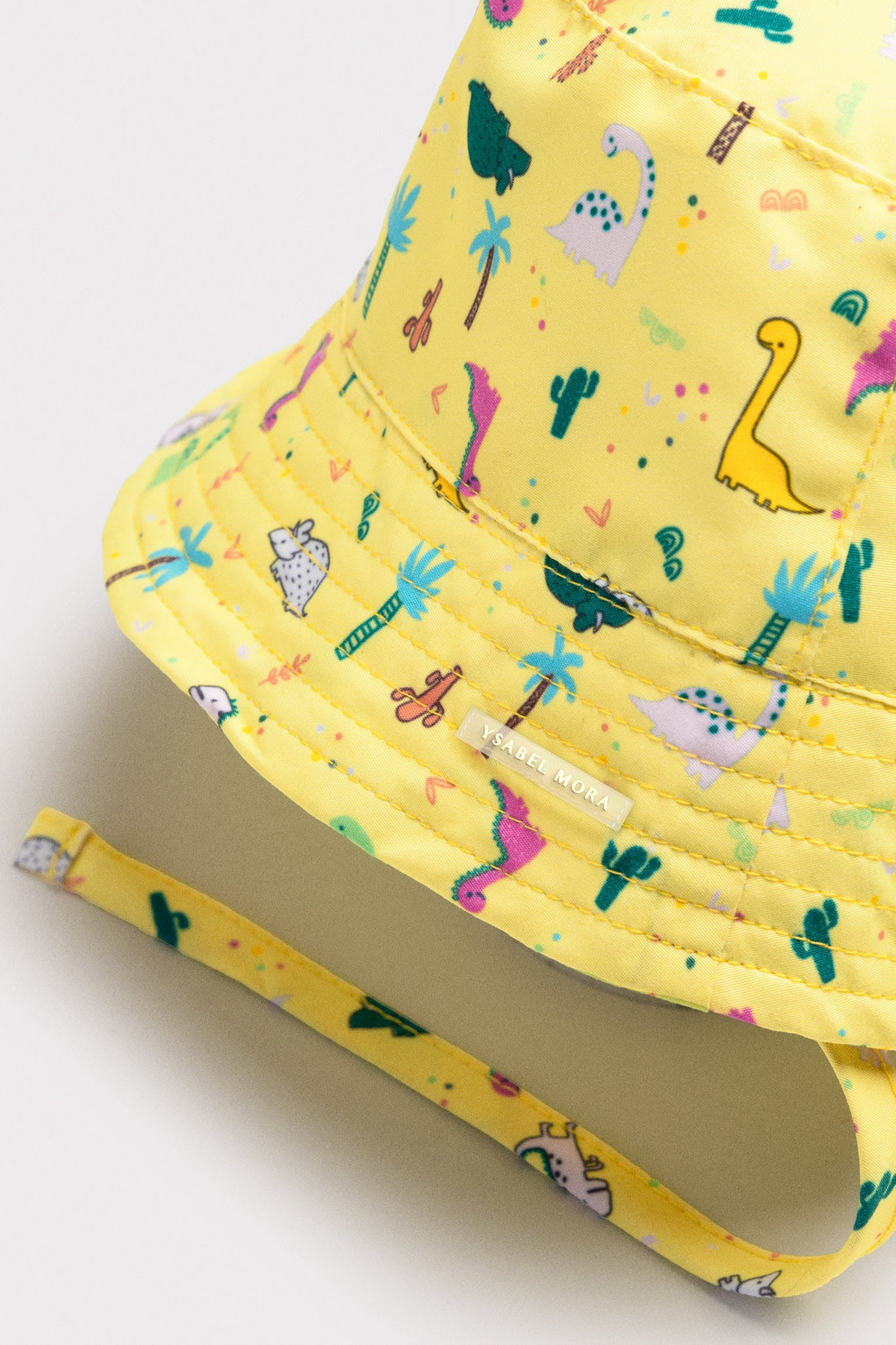 Baby beach hat with straight brim and dinosaur print