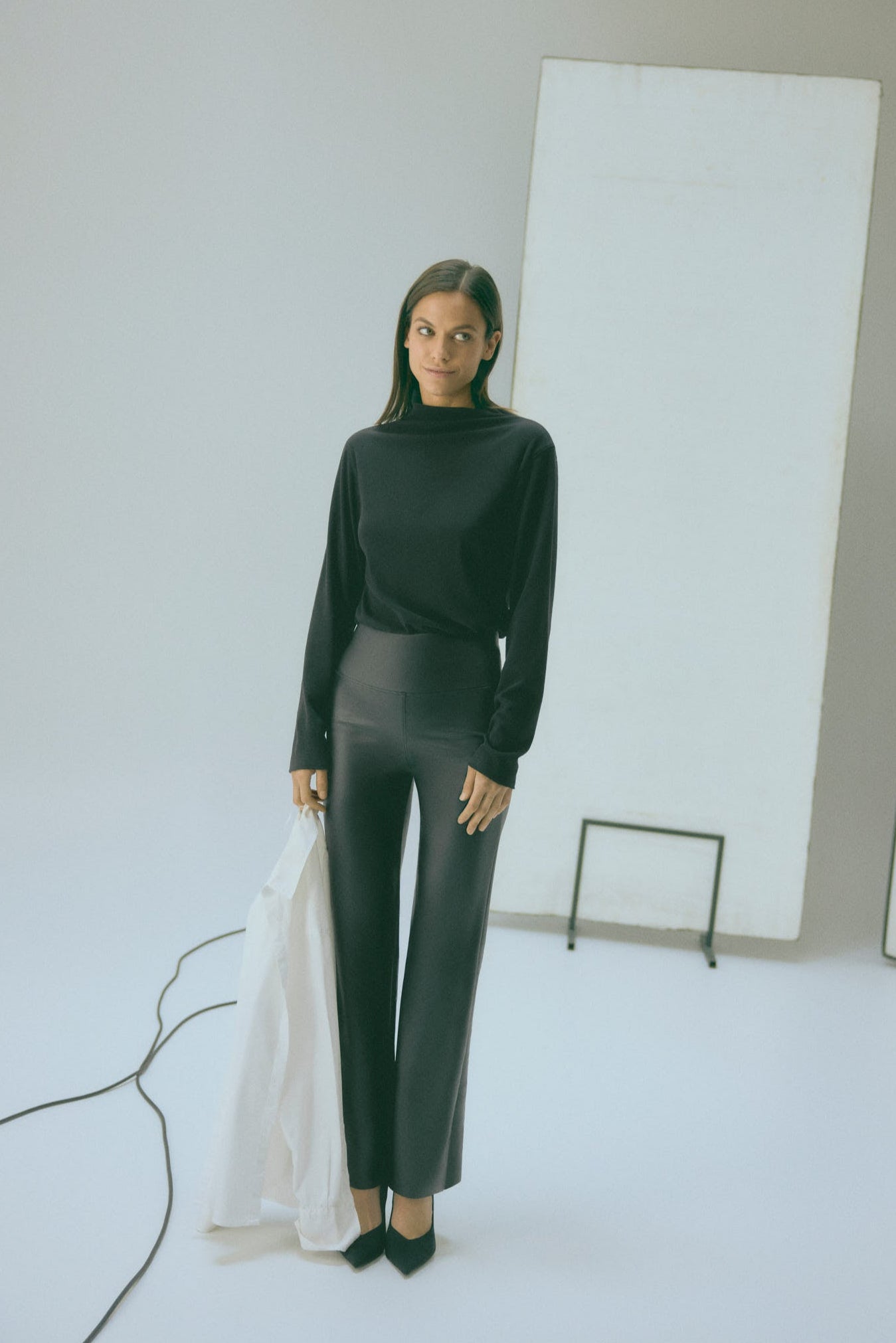 Thermal leggings with flat stomach and black flared leather effect