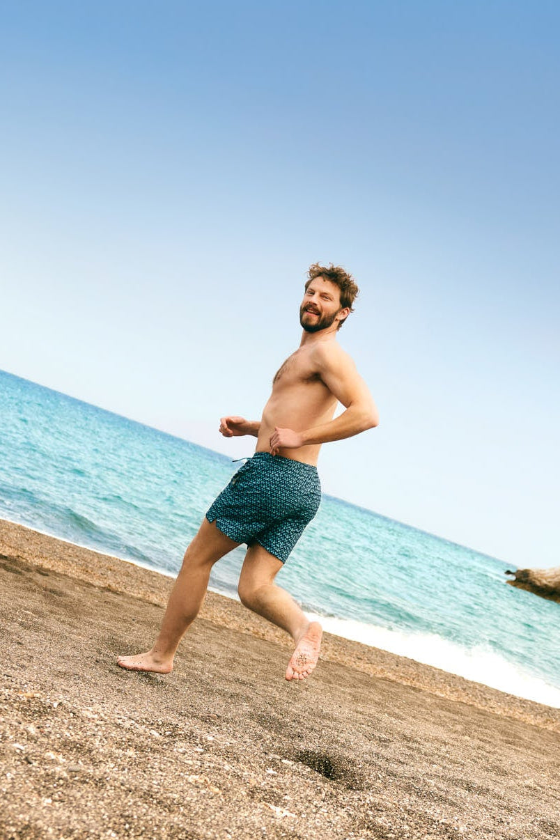 Half swimsuit with anti-chafing mesh lining and tennis racket print