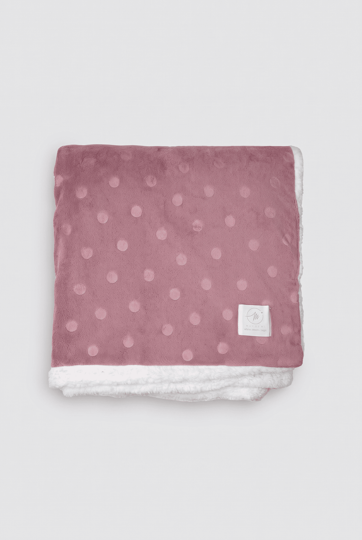Polka-dot coral fleece and shearling blanket