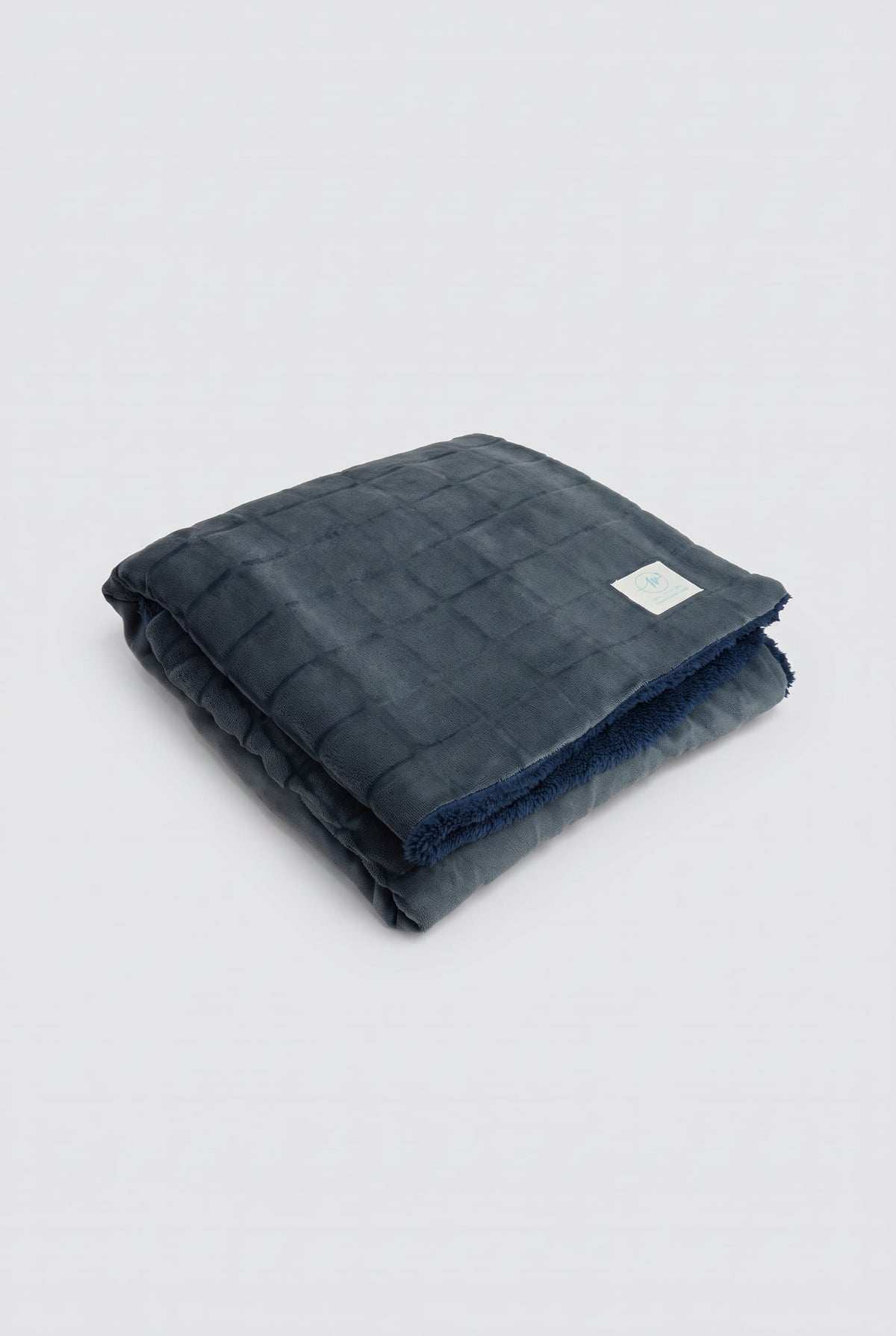 Textured checked coral fleece and shearling blanket